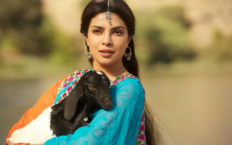 woman holding a goat