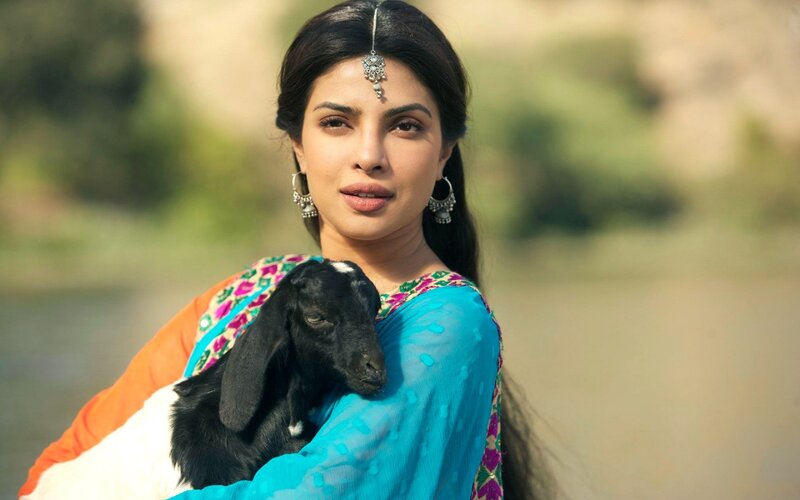Woman Holding a Goat — Blue