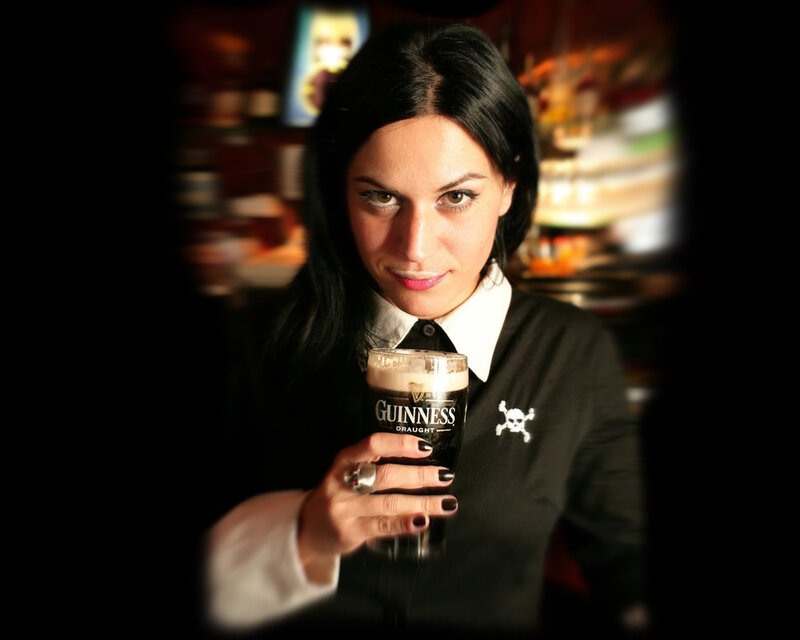 Woman holding a Guinness beer