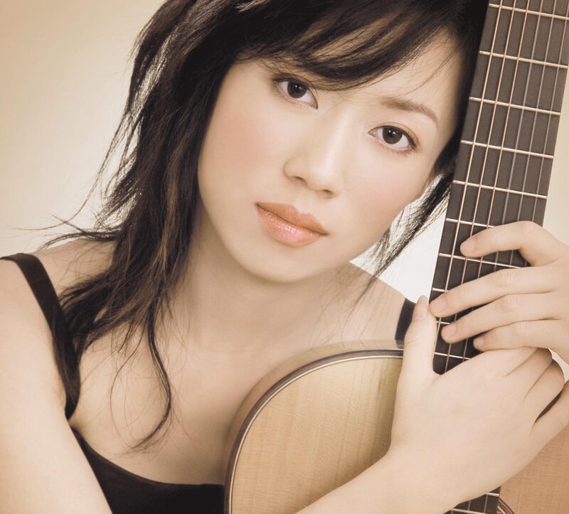 woman holding a guitar