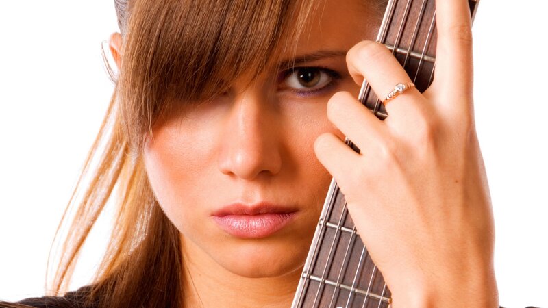 woman holding a guitar
