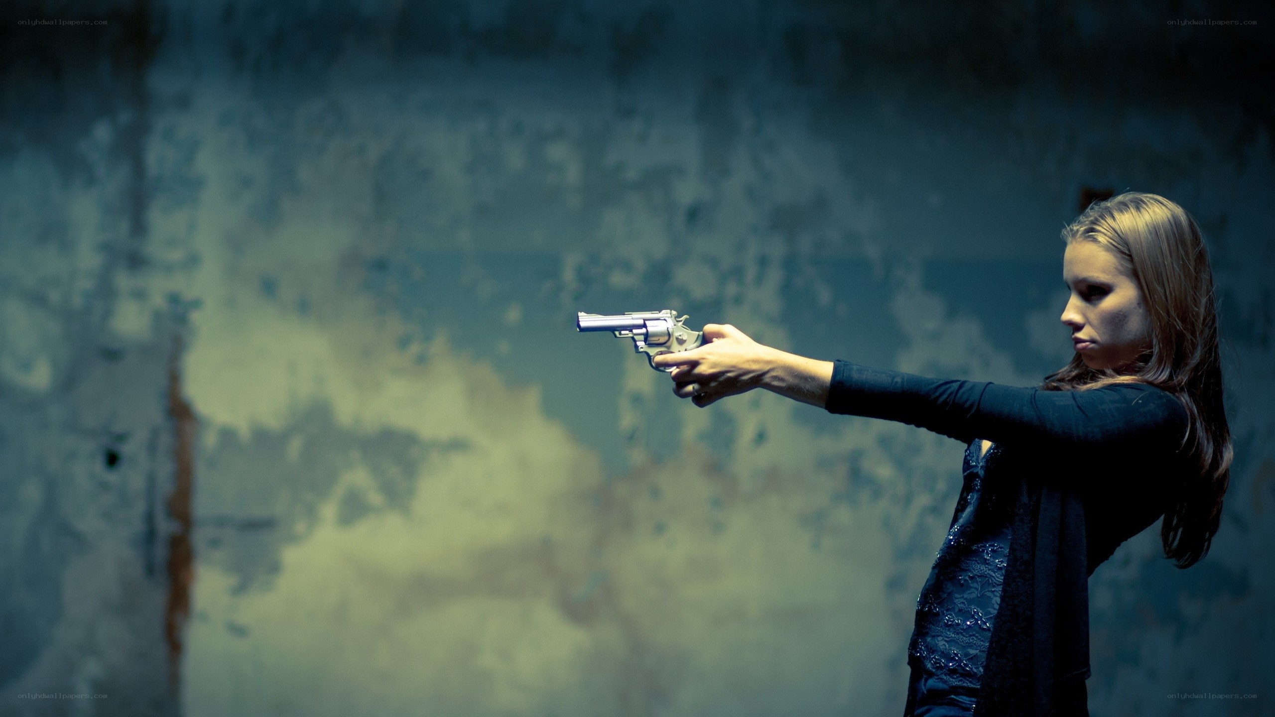 woman holding a gun