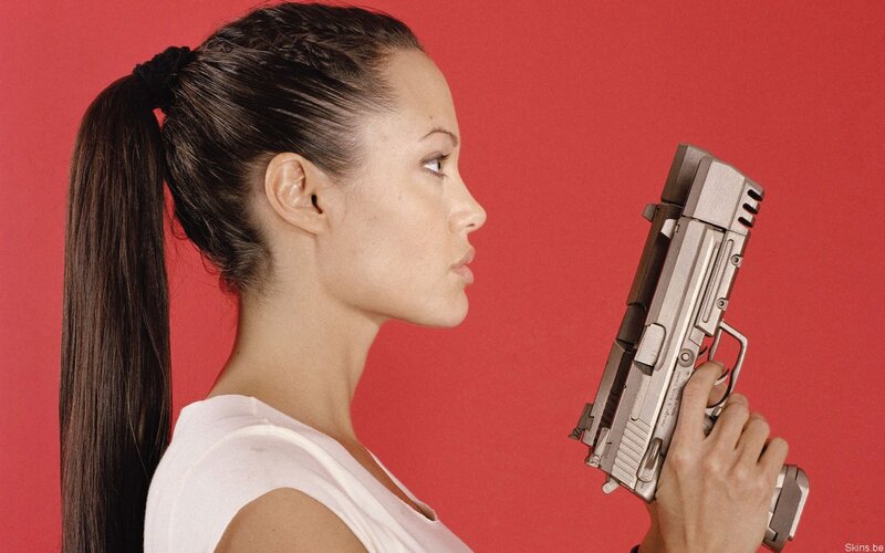 woman holding a gun