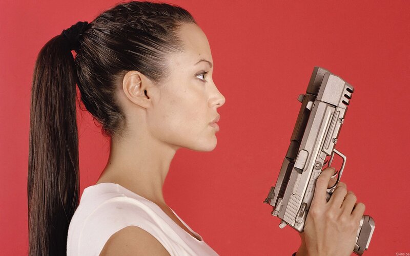 woman holding a gun