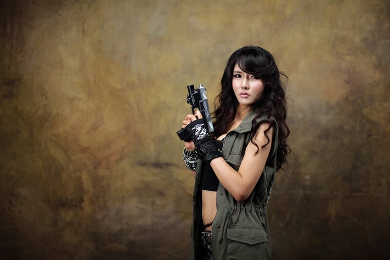 woman holding a gun