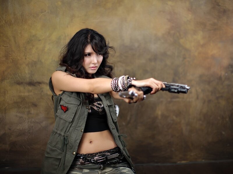 woman holding a gun