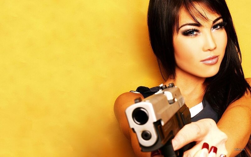 woman holding a gun