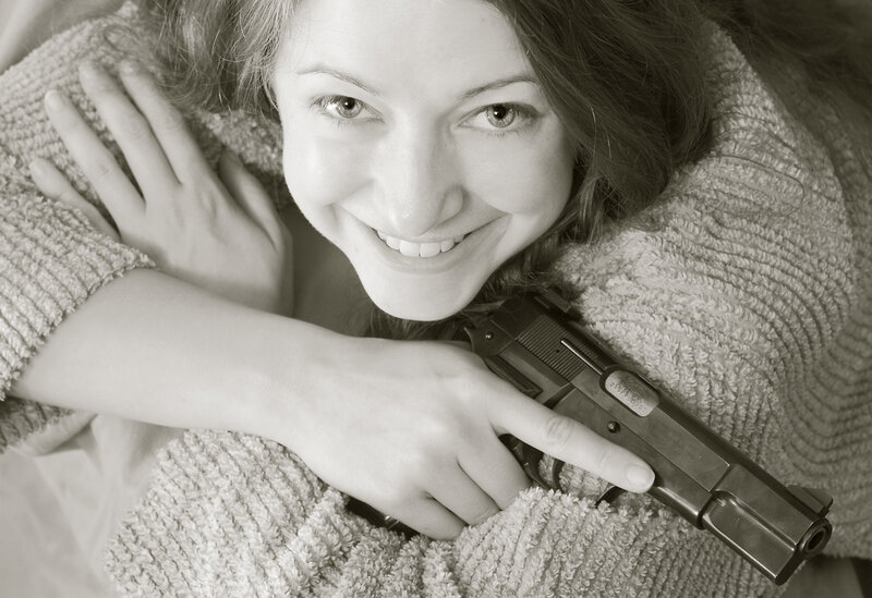 woman holding a gun