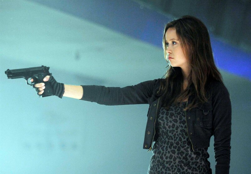 woman holding a gun
