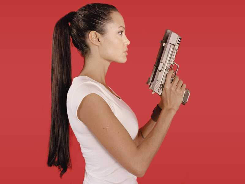 woman holding a gun