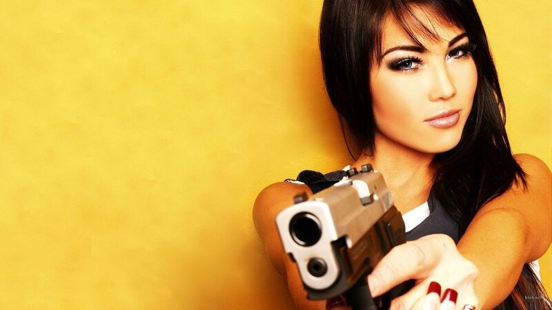 woman holding a gun