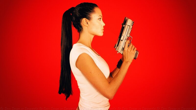 Woman Holding a Gun — Red, Dramatic, Photograph, Ponytail