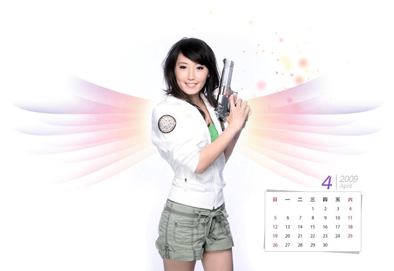 Woman holding a gun with wings