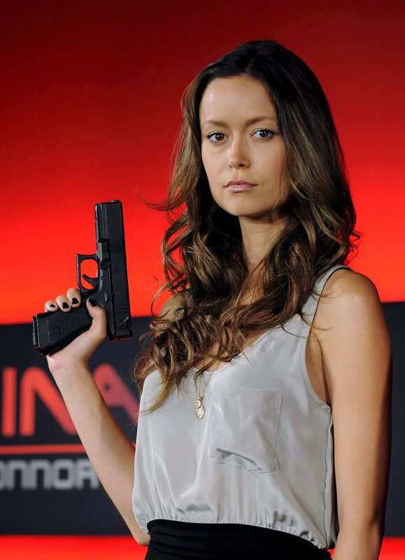 woman holding a handgun