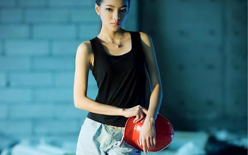 Woman holding a hard hat
