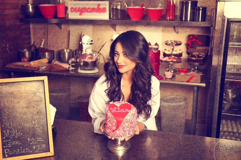 woman holding a heart-shaped cake