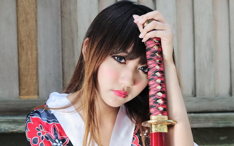 Woman holding a katana