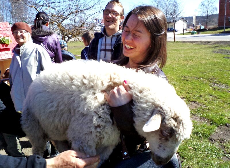Woman Holding a Lamb