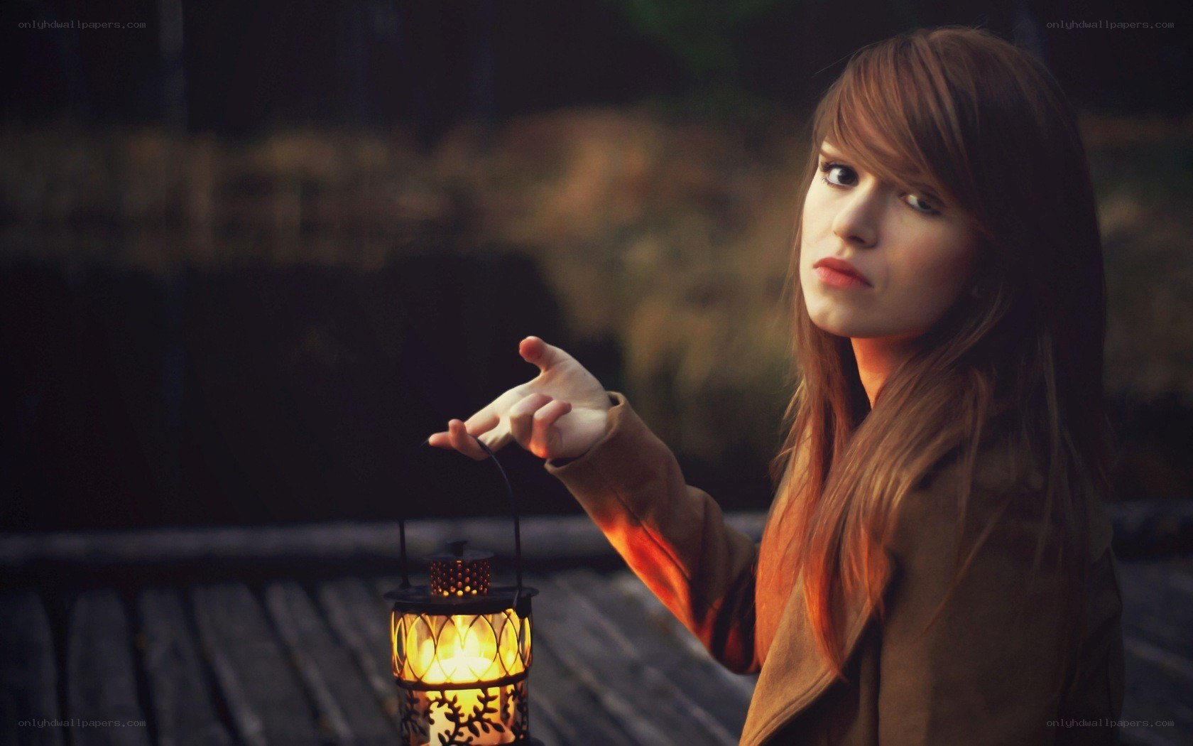 woman holding a lantern