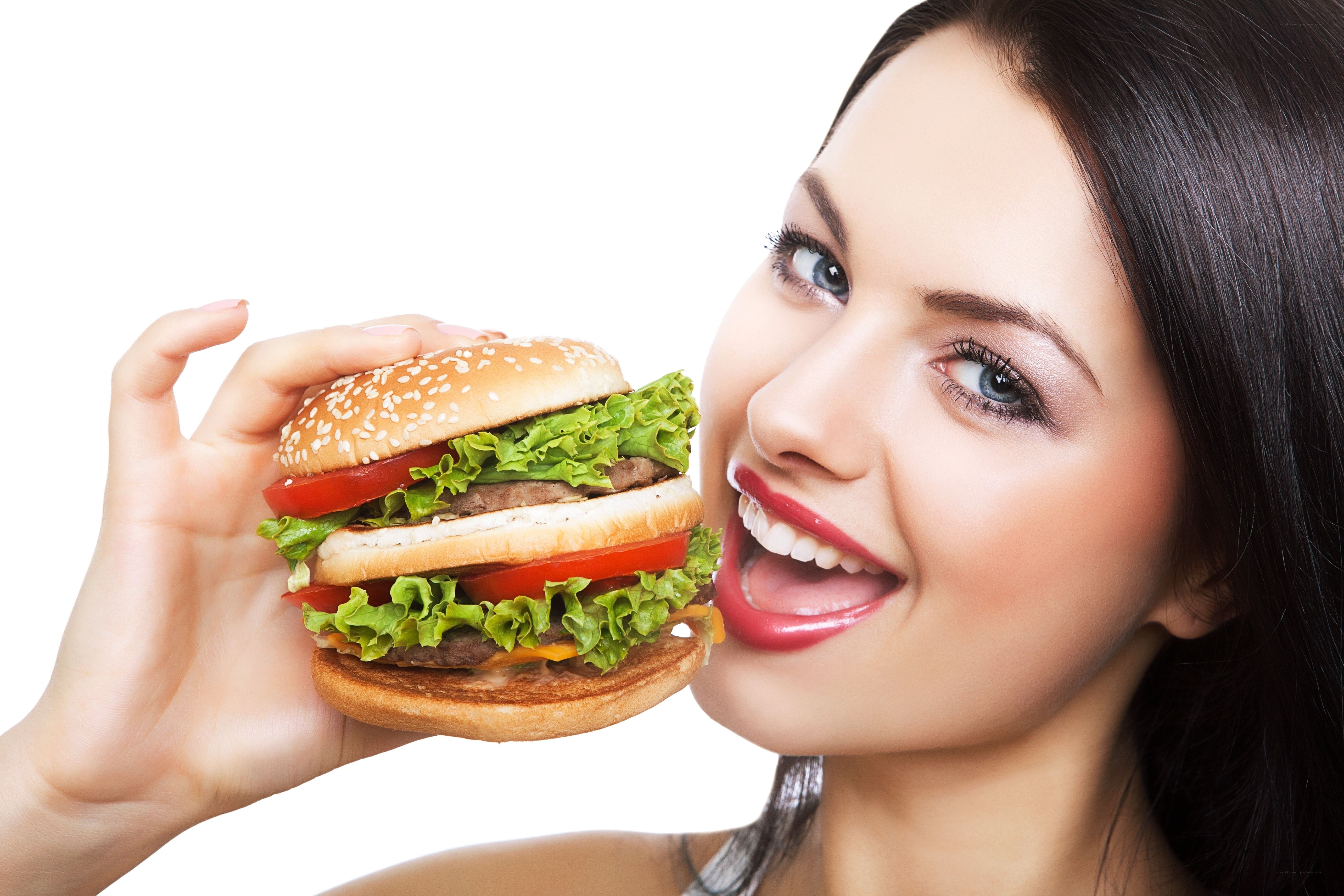 woman holding a large burger