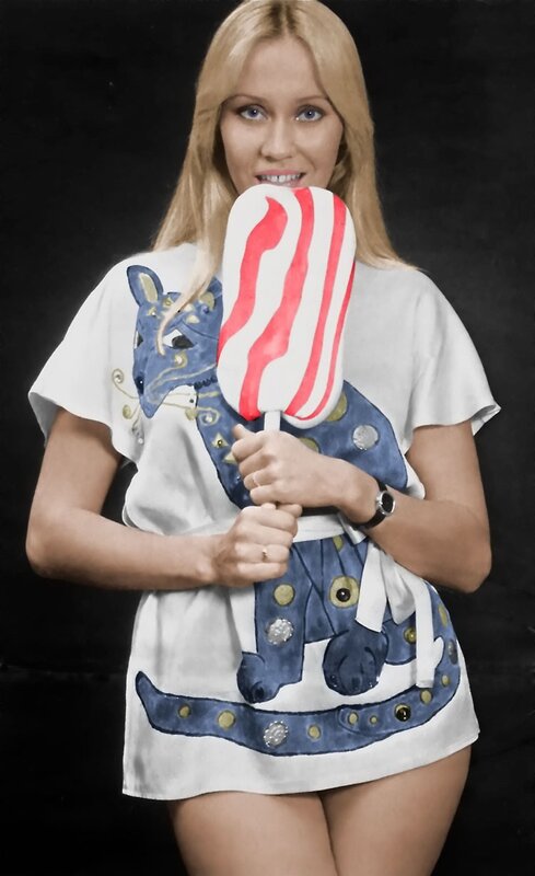 Woman holding a large lollipop