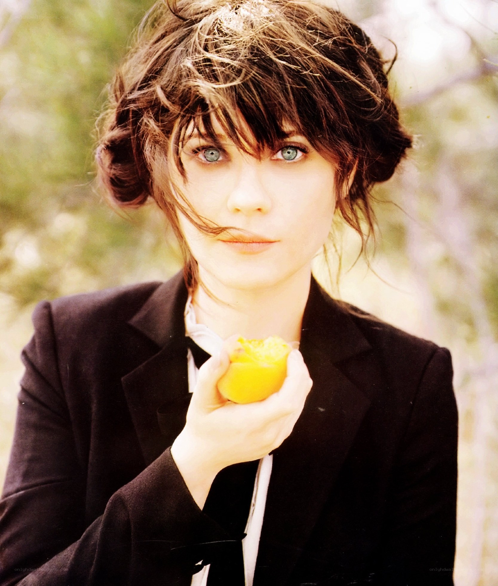 woman holding a lemon