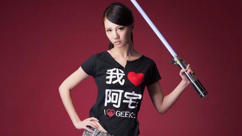 Woman holding a lightsaber