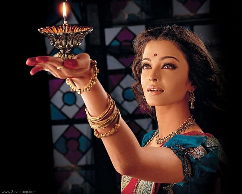 woman holding a lit diya