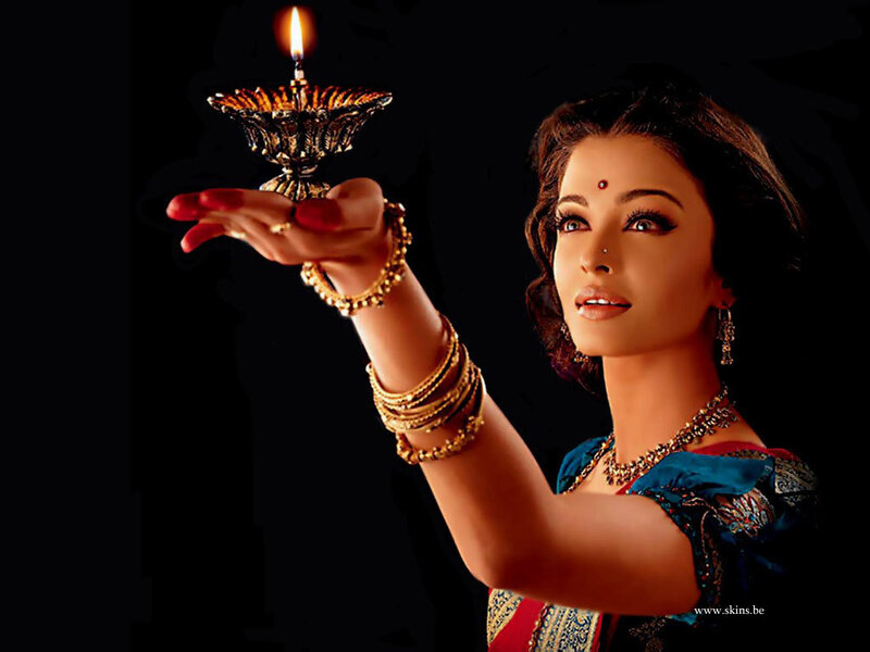 woman holding a lit lamp