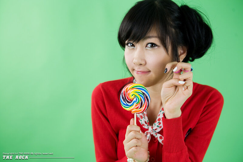 woman holding a lollipop