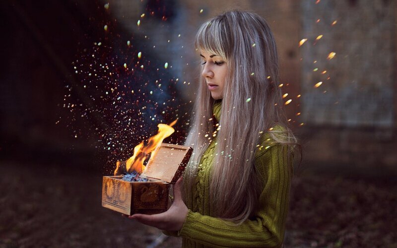 woman holding a magical box