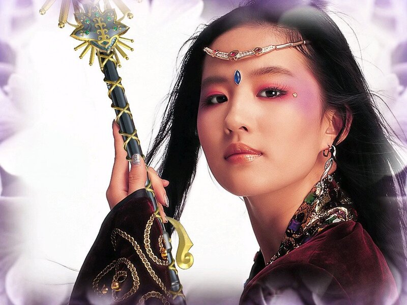 woman holding a magical staff
