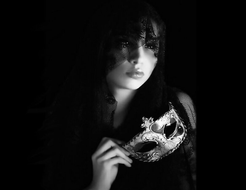 woman holding a mask