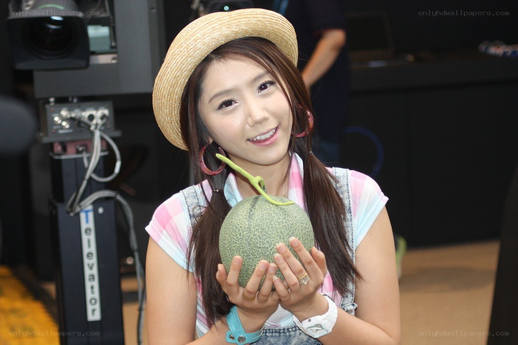 woman holding a melon