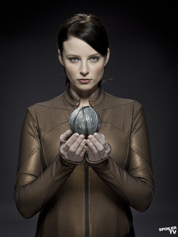 woman holding a metallic sphere