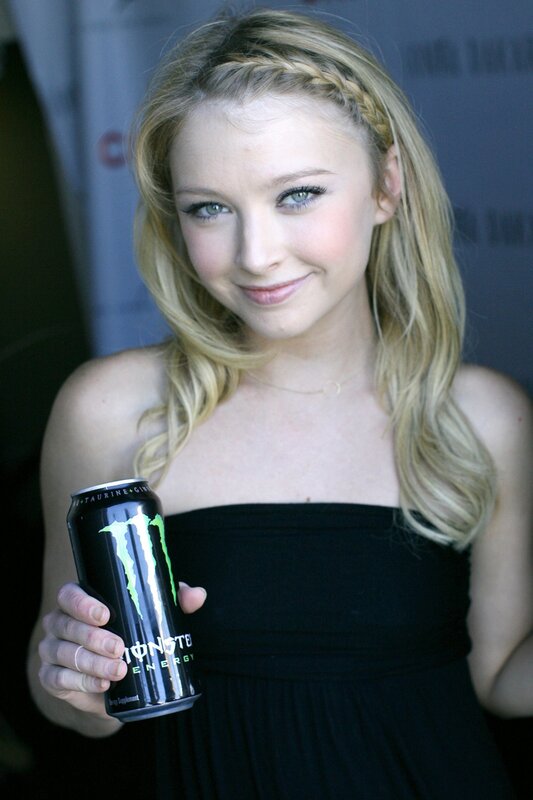 Woman holding a Monster Energy can