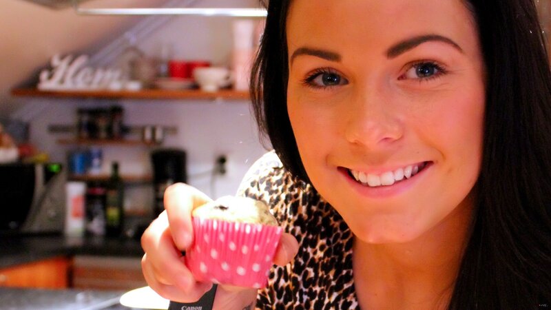 woman holding a muffin