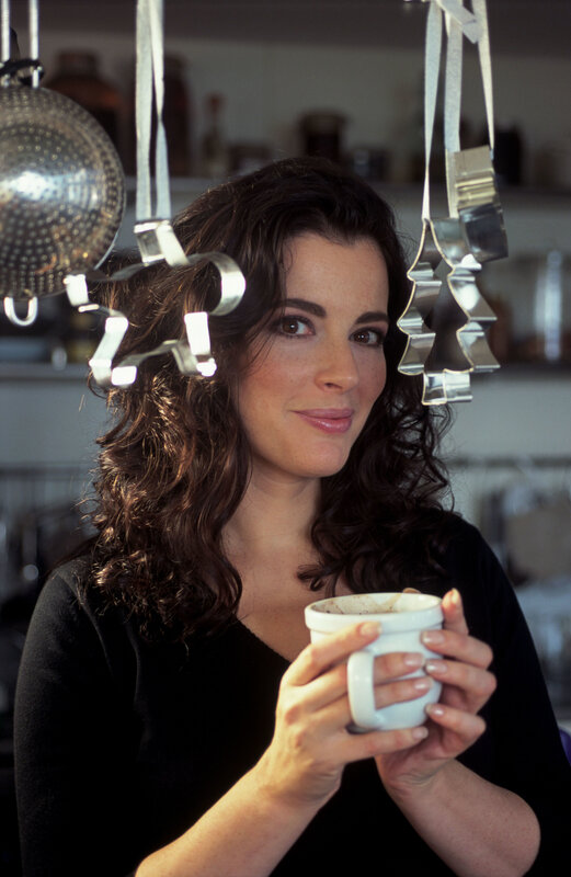 woman holding a mug in kitchen