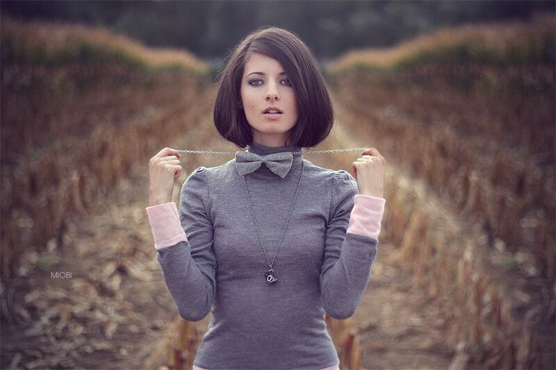 Woman holding a necklace