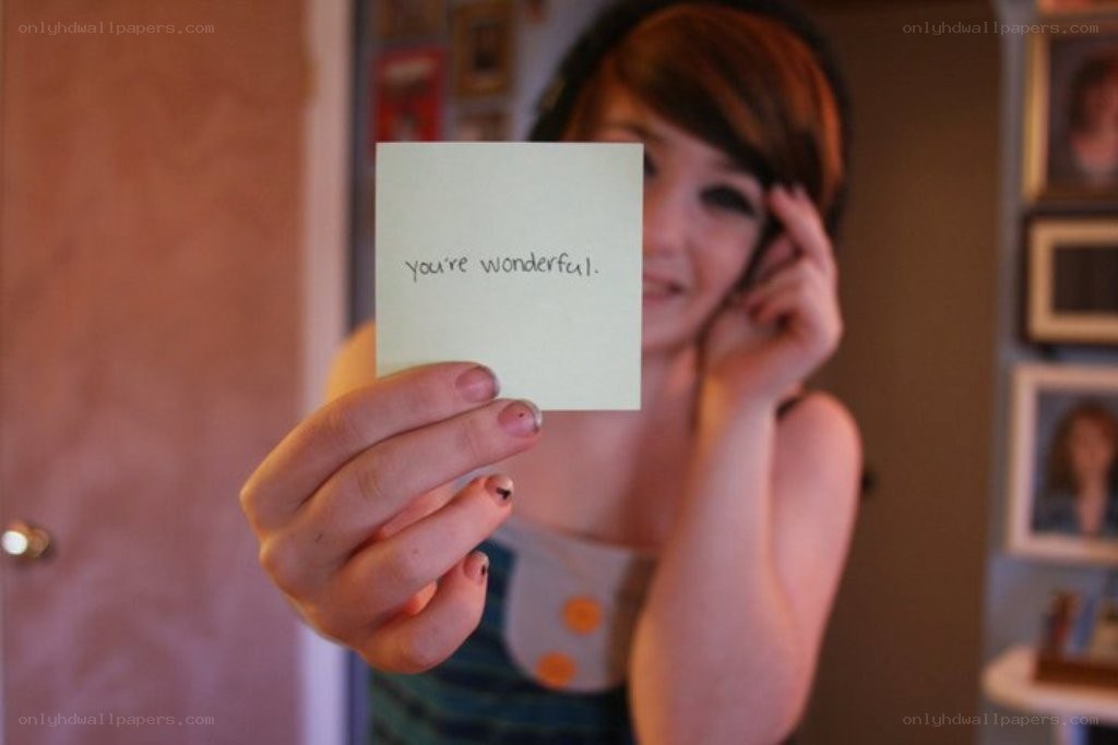 woman holding a note