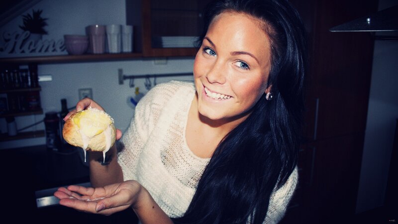 woman holding a pastry