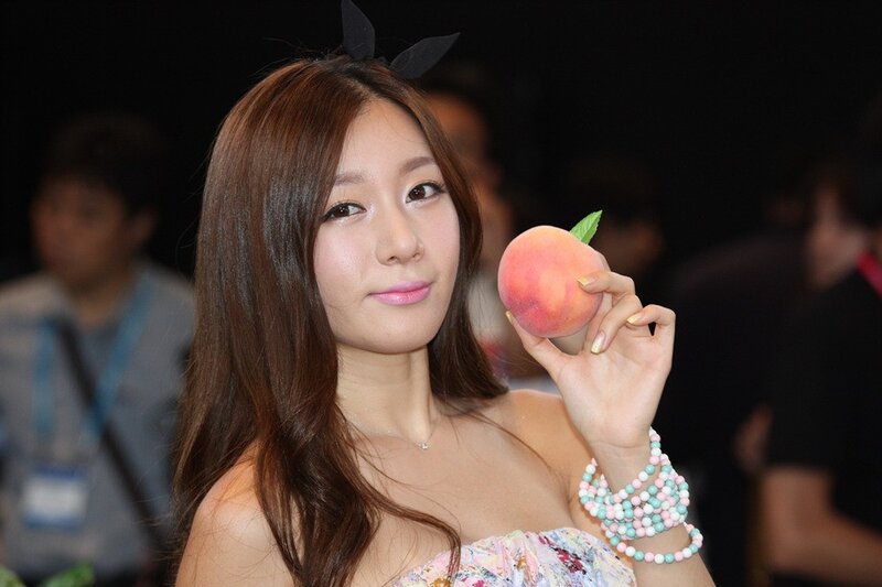 Woman holding a peach