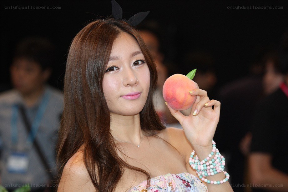 Woman holding a peach