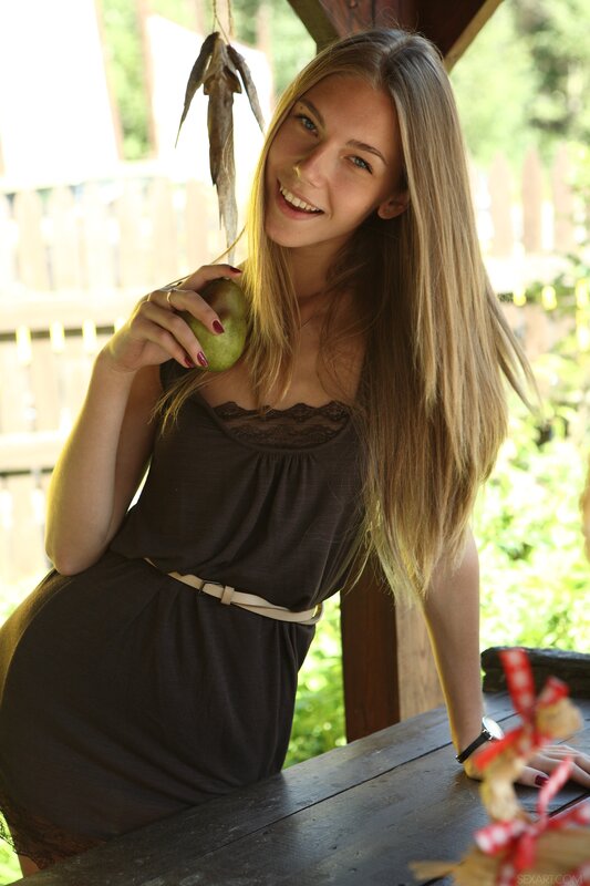 woman holding a pear