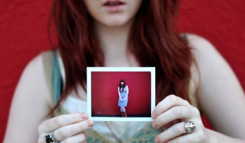 woman holding a photo