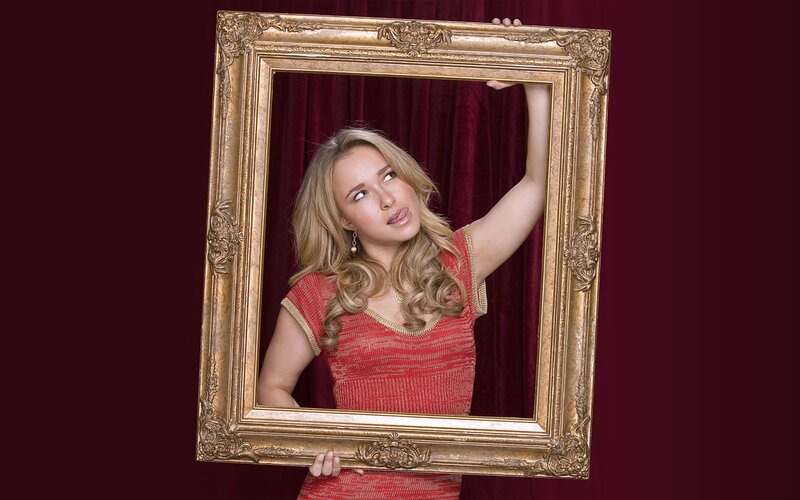 woman holding a picture frame