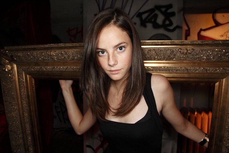 woman holding a picture frame