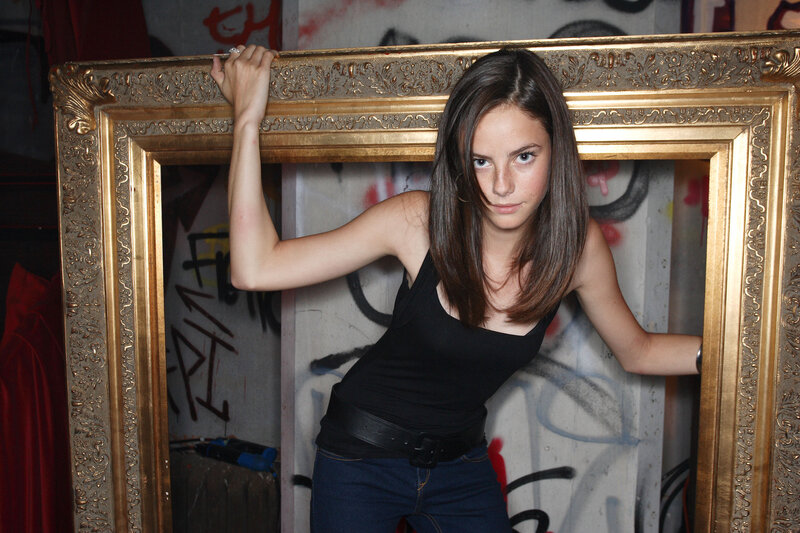 woman holding a picture frame