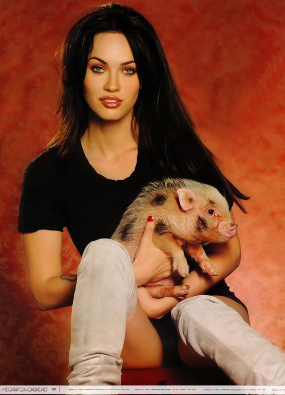 woman holding a piglet