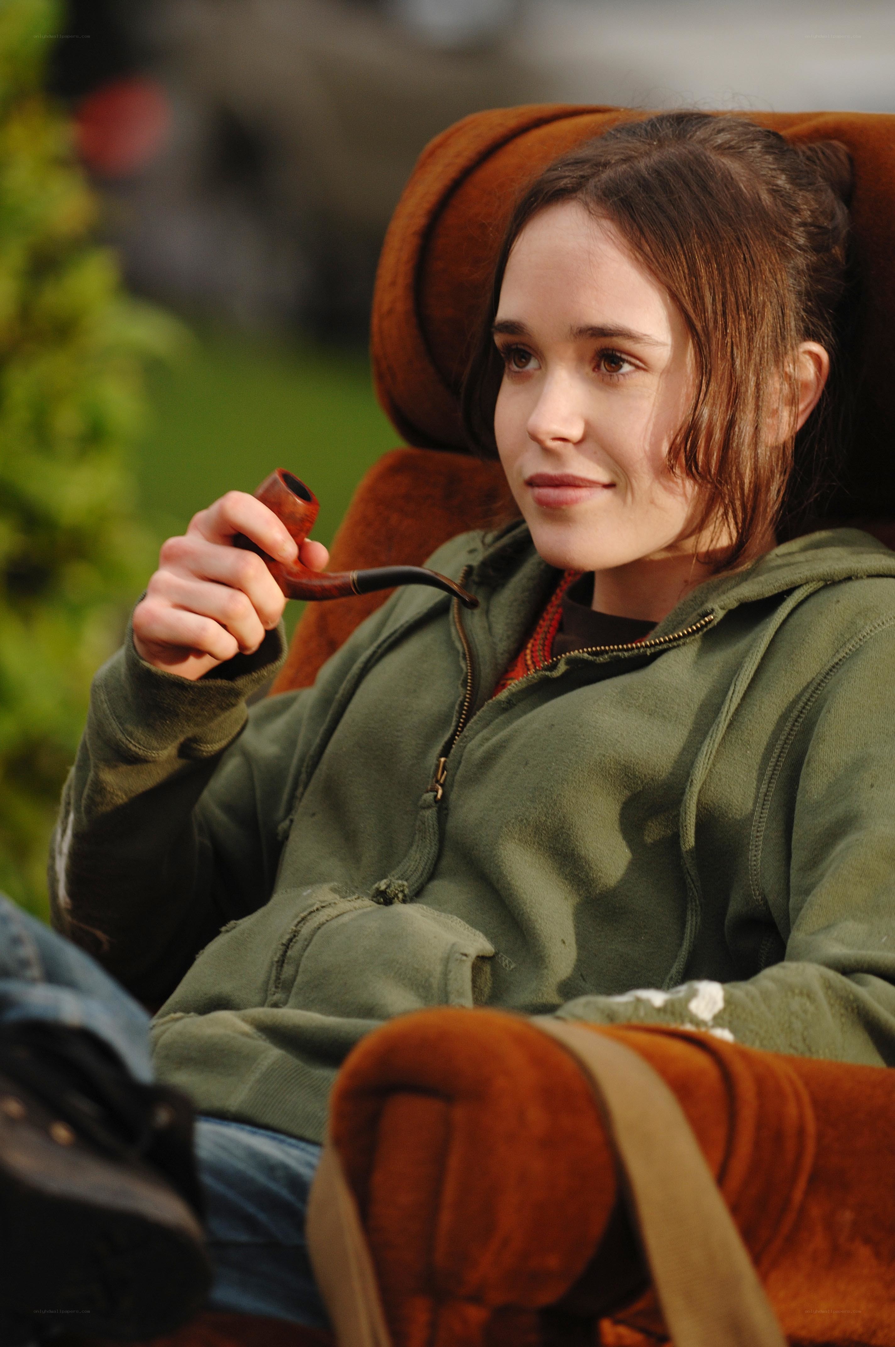 woman holding a pipe